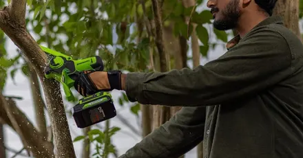 Greenworks 24V 6-inch Cordless Electric Mini Chainsaw with a 2.0Ah battery